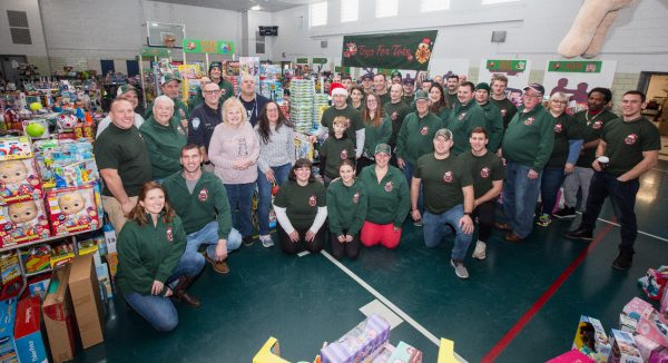 Smile: Toys for Tots volunteers and Co-chairmen all get together for a group photo, as they are proud of their work. (taken December 23, 2023)  Photo Courtesy: Shannon Hannigan