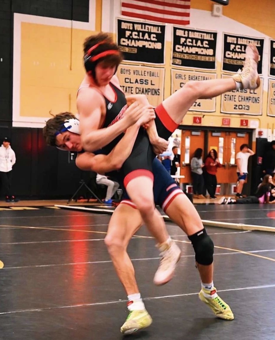 Takedown!: Junior Thomas Mahon throwing down his opponent December 28, 2024
