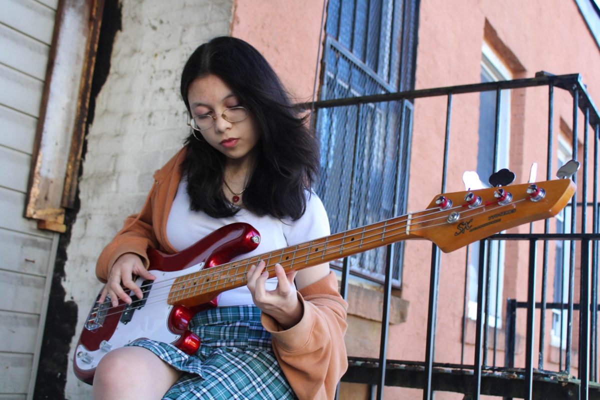 She Plays Bass: Cohen playing the bass, December 30, 2024. Photo courtesy: Ava McLaughlin