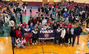 Class M champions: Taking a look at Foran Wrestling getting excited after winning the Class M tournament .  Photo courtesy: Sandra Aspras.