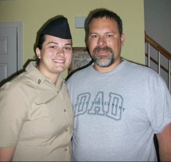 Stewart in Outfit: Stewart with her father taking a picture in her Navy suit after boot camp graduation, March 2009. Photo Courtesy: Emily Stewart