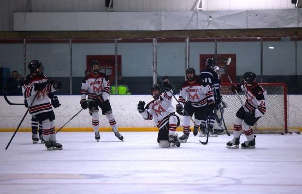 Shoot, Score: Lavallee celebrates a goal with his team. Photo courtesy: Maria Crocco. March 3, 2025. 
