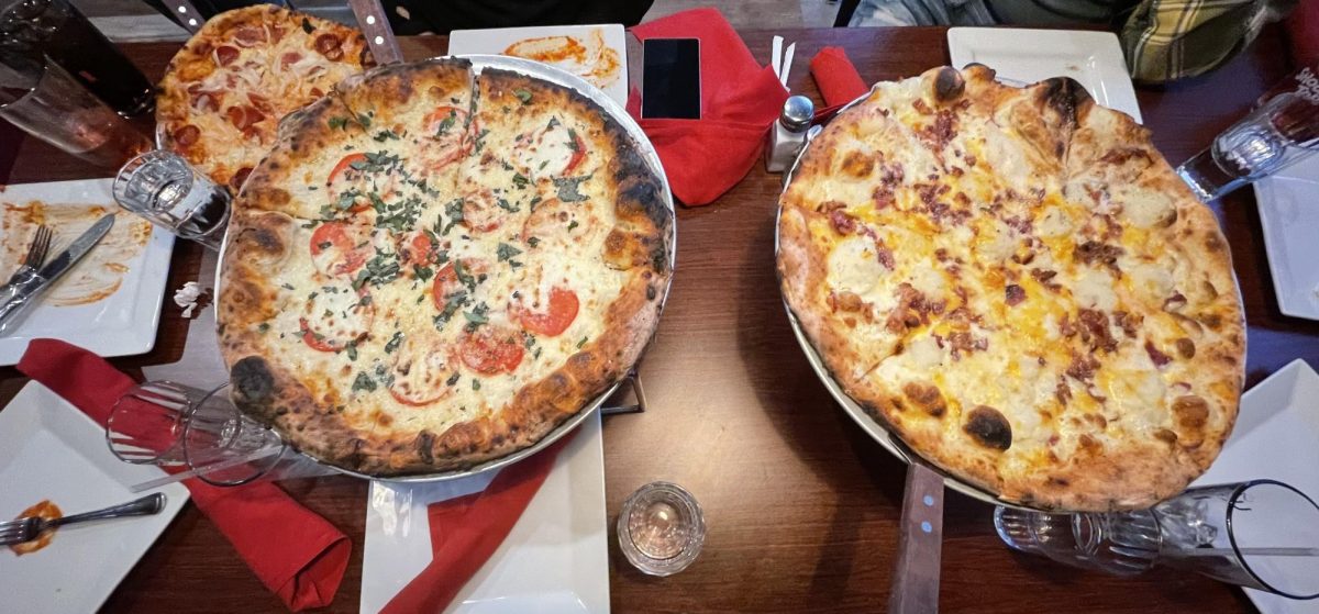 “This Pizza is Fire!”: Fire Engine Pizza Co.’s loaded mashed potato pizza and mozzarella margherita pizza. Photo Courtesy: Caroline Kidahl-Olmeda. March 29, 2025. 