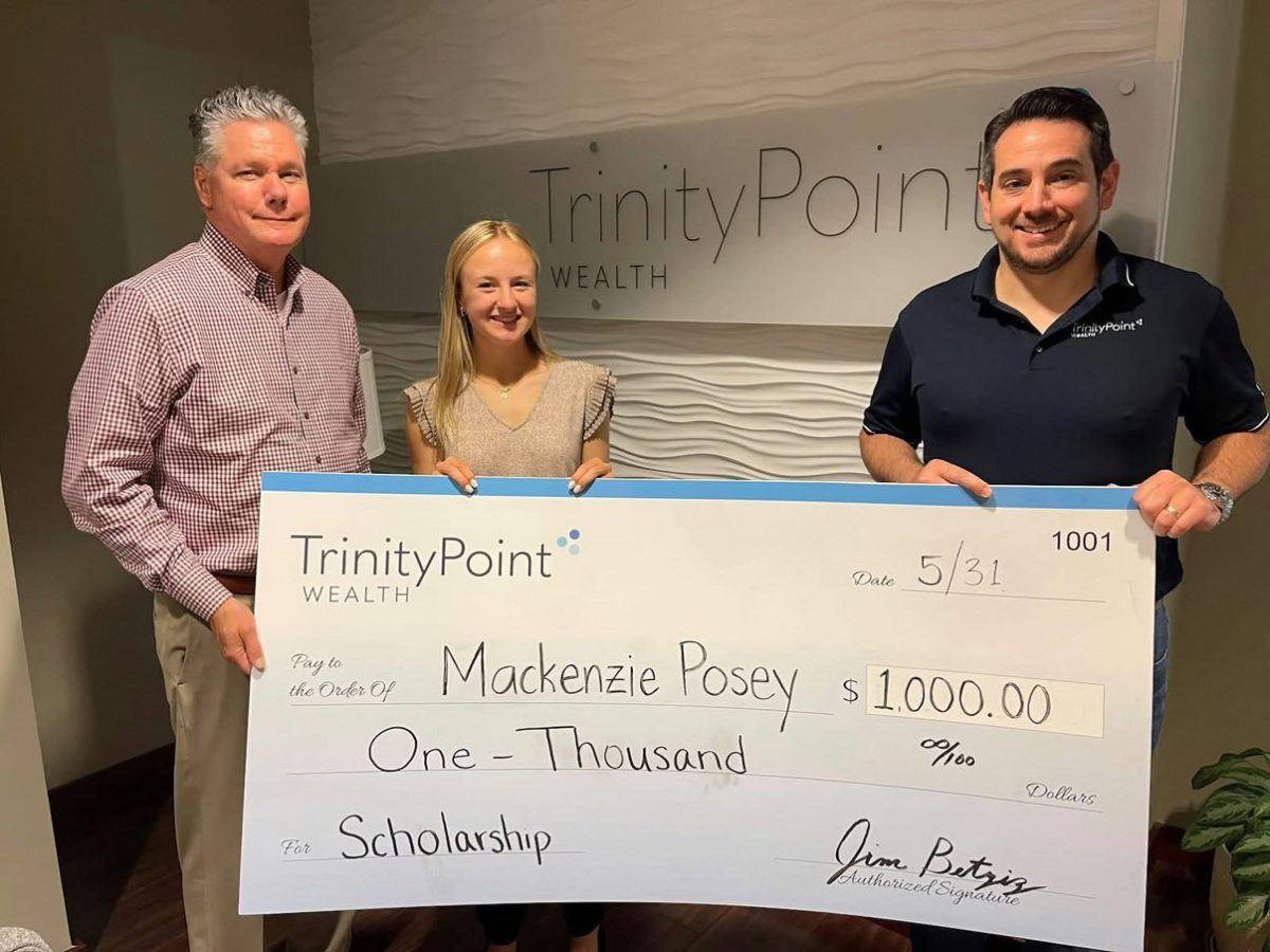 Scholarship Presentation: Posey stands with members of the TrinityPoint Wealth team after being awarded a $1,000 scholarship for her dedication and performance during her internship,. Photo Courtesy: Alisa White