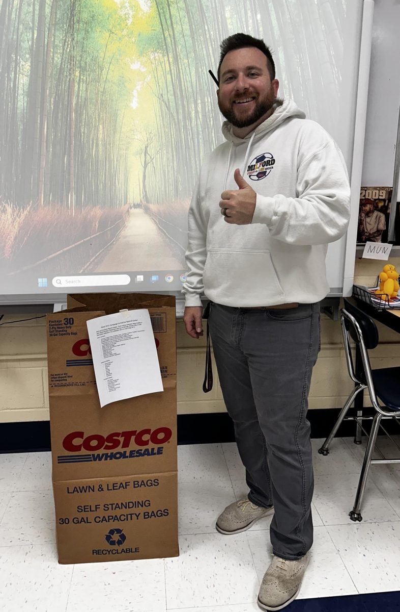 Collecting for a Cause: Social Studies teacher Mr. Zachary Phelan. September 12, 2025. Photo courtesy: Andrew Bishop.
