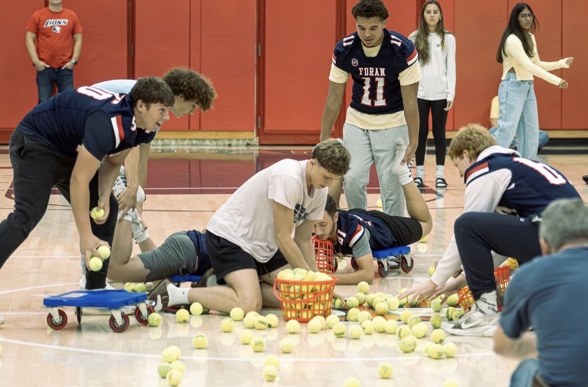 Hungry Hungry Hippos Game: Students race to collect the tennis balls in their bins. September 26, 2025. Photo courtesy: Addi Mangosing.
