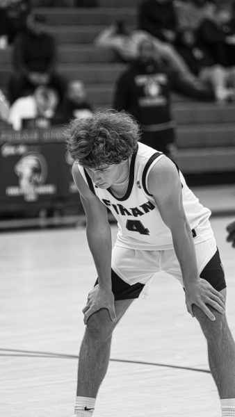 Drowning Out the Noise: Junior John Johnson drowning out the noise before a big free throw. December 30, 2024. Photo courtesy: Addi Mangosing.