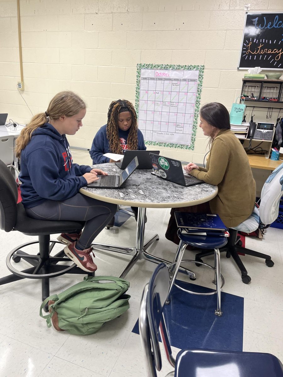 A teacher helping a student: helping students in the numeracy center on October 15, 2025. Photo Courtesy: Jack Laird