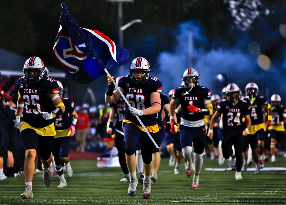 Small But Mighty: The Foran Lions take the field before their home opener, September 26, 2025. Photo Courtesy: Maria Crocco
