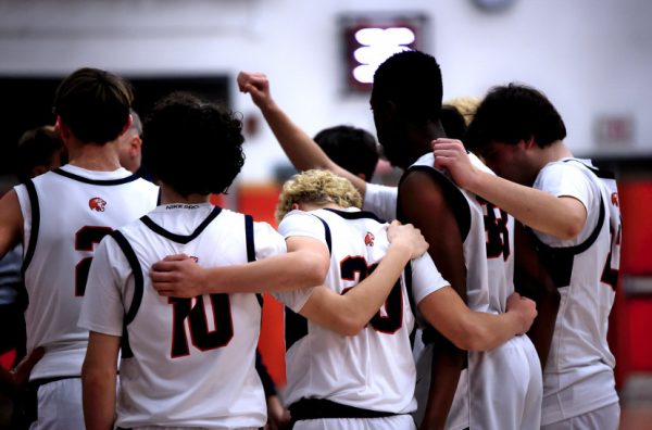 Inside The Huddle: The Foran basketball team talks over their strategy, December 17, 2024. Photo courtesy: Maria Crocco