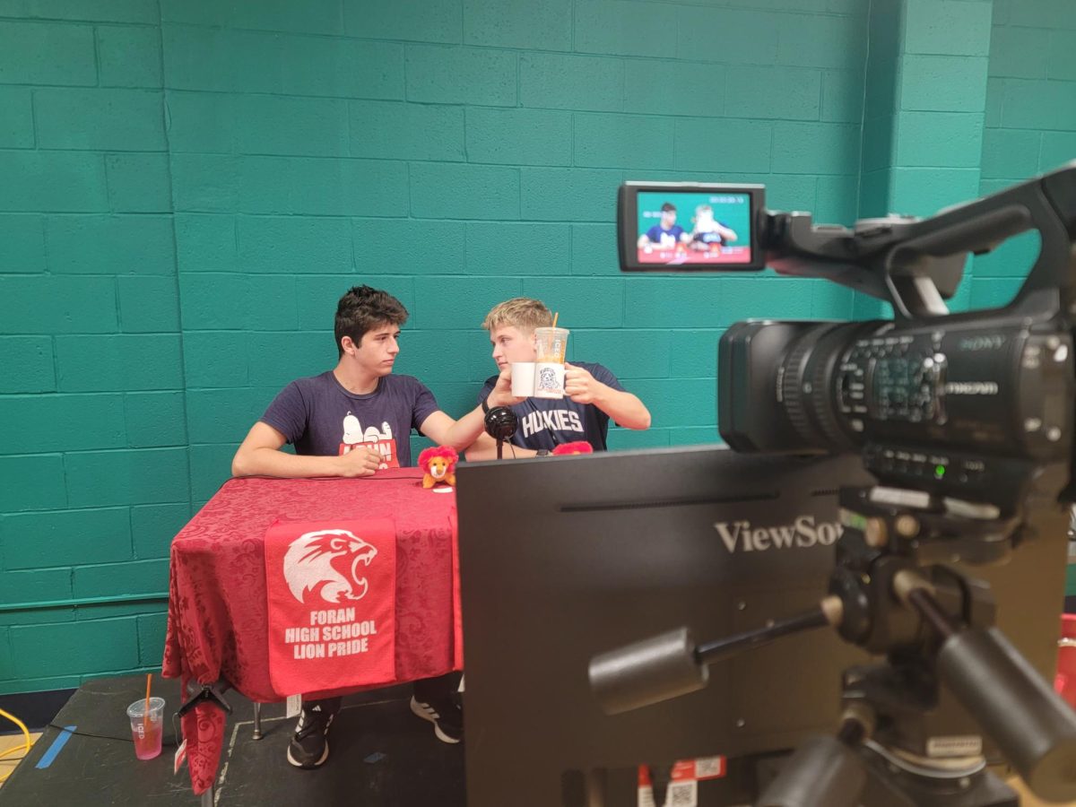 Iconic Sendoff: Mike Rich and Joey Kerzner performing their broadcast outro by clanging their mugs. October 8, 2025. Photo Courtesy: Rodney Thomas.