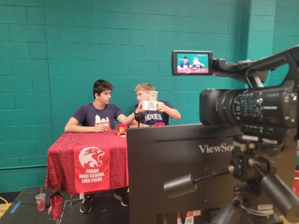Iconic Sendoff: Mike Rich and Joey Kerzner performing their broadcast outro by clanging their mugs. October 8, 2025. Photo Courtesy: Rodney Thomas.