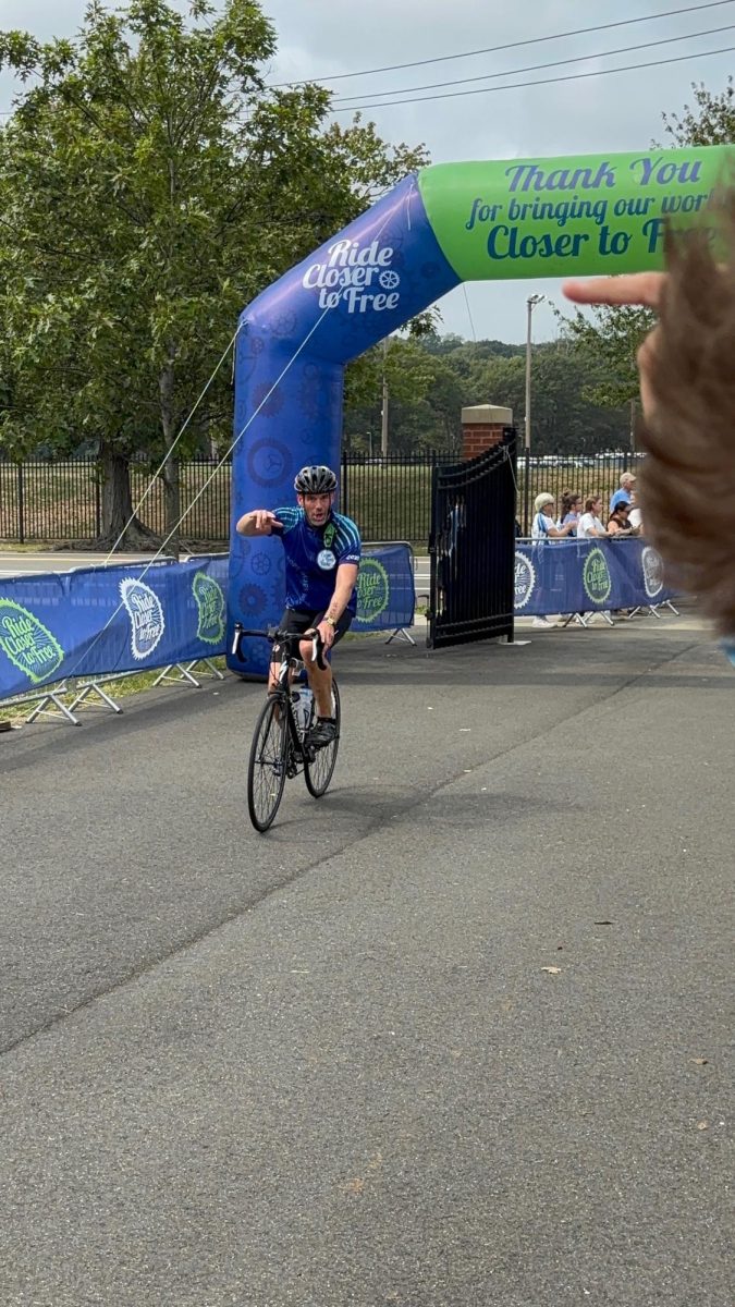 Finish Line of Liberation and Pride: Cyclist riding down the finish line with open arms reaching for those deep in their heart. September 6, 2025. Photo courtesy: Jack Henkel.