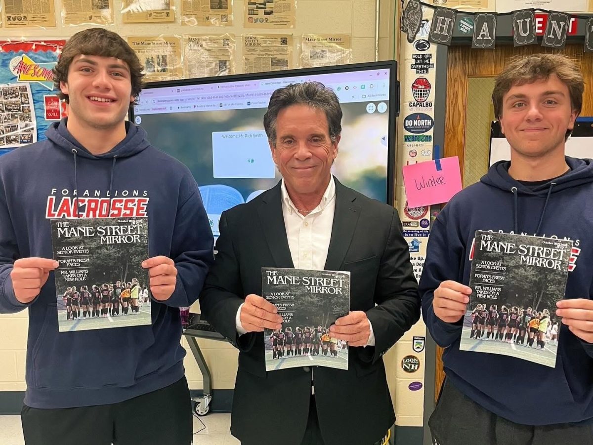 City News: Foran journalism students holding issue of Mane Street Mirror after interviewing then-mayoral candidate Rich Smith for their story, October 22, 2025. Photo Courtesy: Lisa Farrell.