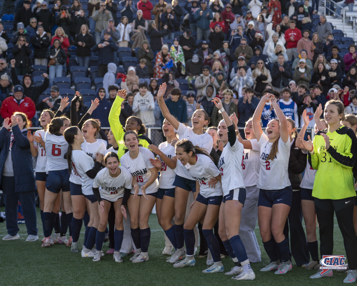 On Top of the World: Lady Lions pose with their CIAC Class M State Championship plaque, November 15, 2025. Photo Courtesy: CIAC - Jada Bird Media.