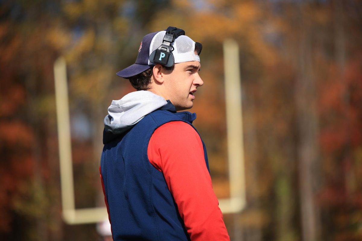 In Action: Coach Ross takes the field to lead the Lions, November 1, 2025. Photo courtesy: Maria Crocco.