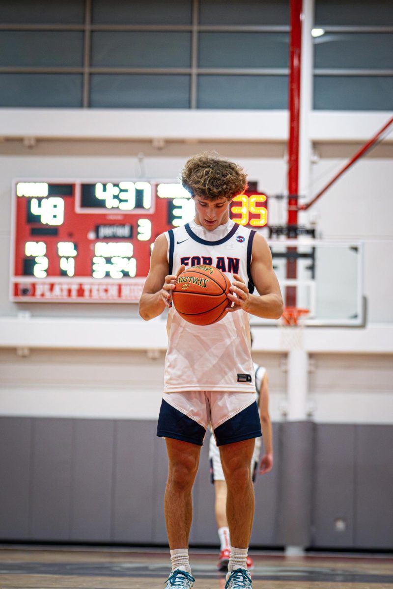 Lining Up: Guard John Johnson lining up to shoot free throws after a foul, December 27, 2024. Photo courtesy: Addi Mango.
