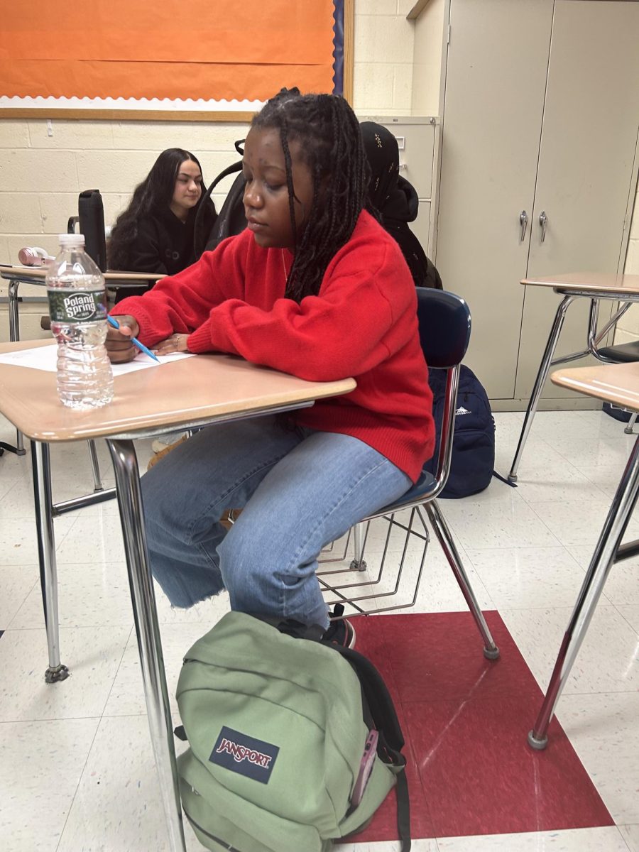 Locked in During Class: Ninth grader Natalie Mutambo working on a French assignment, January 30, 2026. Photo Courtesy: Tahilia Rashford.