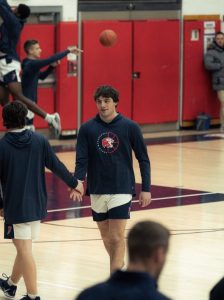 Game Time Energy: Conte encourages his teammates before tip-off, bringing confidence and team spirit on the court,
March 11, 2026. Photo courtesy: Addi Mangosing
