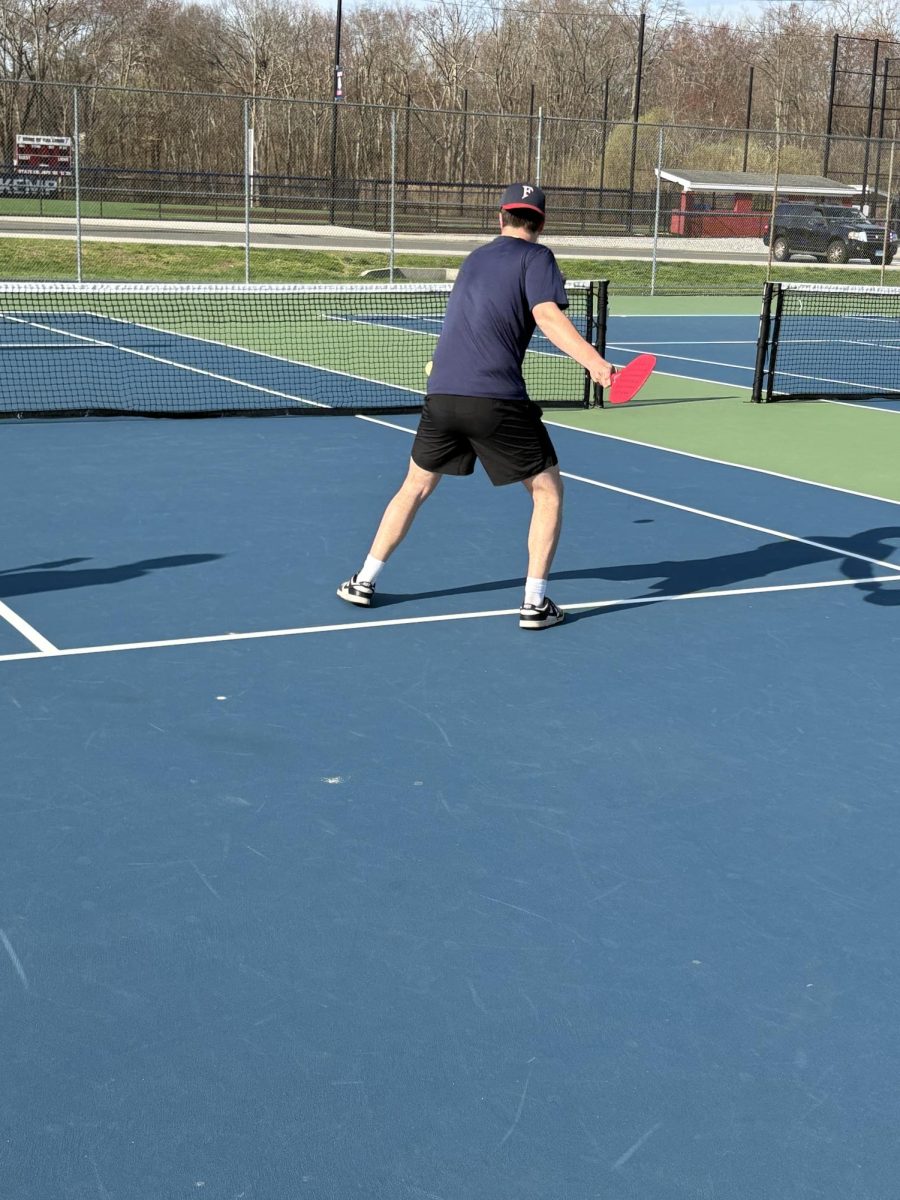 Serve and smash: Jason Hockenberry returns a serve, May 3, 2026.  Photo Courtesy: Santino Scaranuzzo.